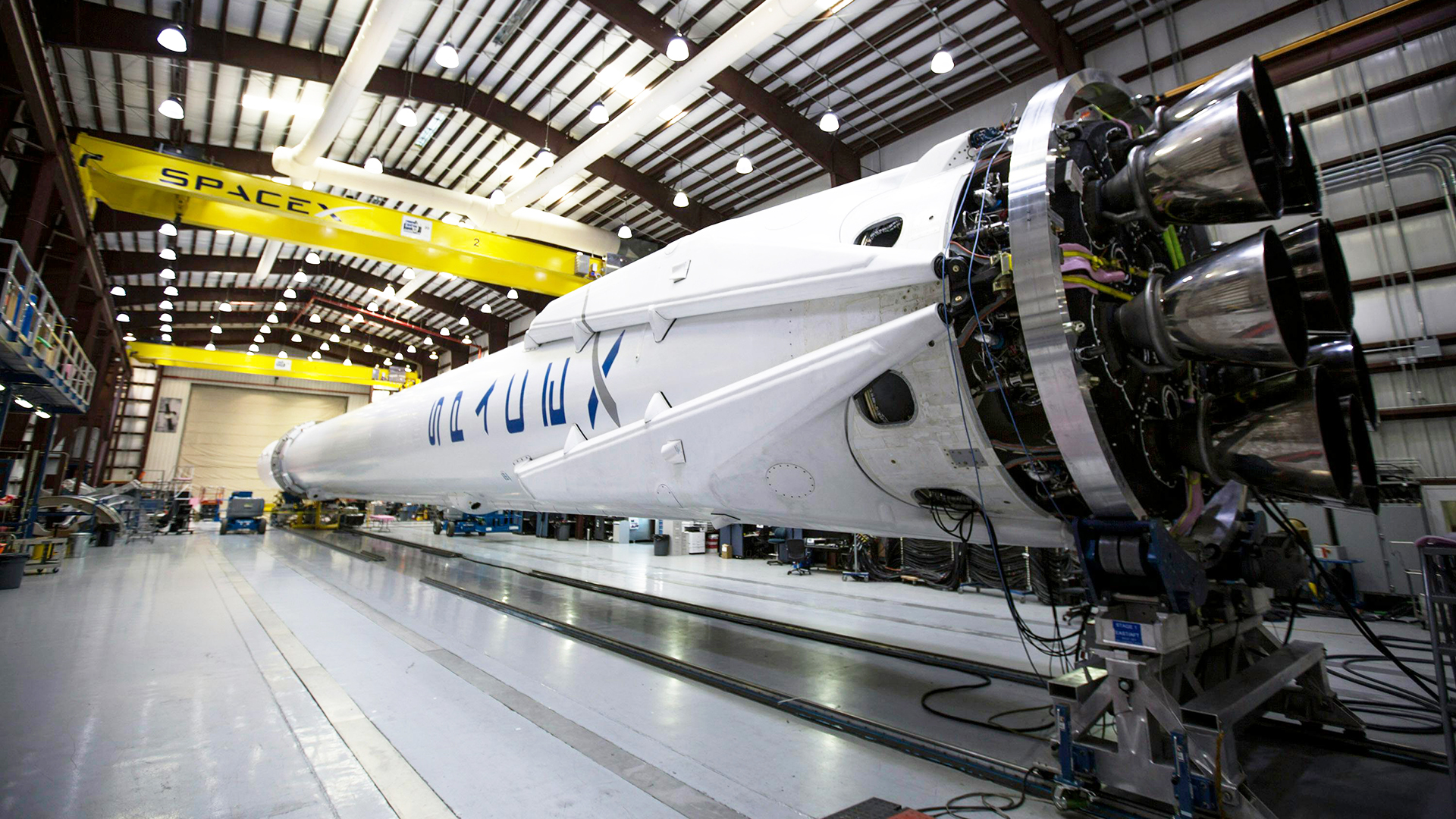 SpaceX Falcon 9 at the integration facility. Virtual background to use on Zoom, Microsoft Teams, Skype, Google Meet, WebEx or any other compatible app.